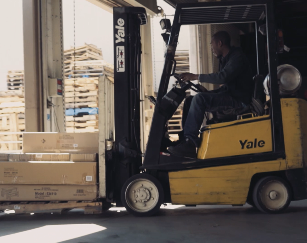 Forklift driver in warehouse